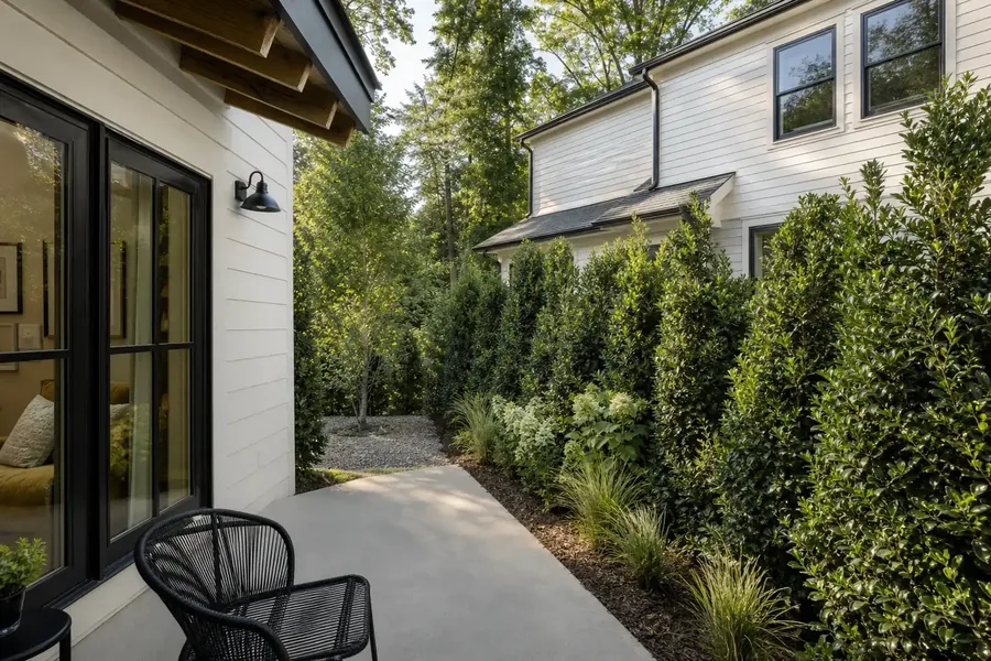 Concept view of windows and screening between nearby dwellings Patio of a small dwelling facing a planted buffer and neighboring house
